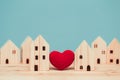 Love heart between two house wood model for stay at home for healthy community together concept Royalty Free Stock Photo