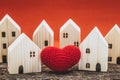 Love heart between two house wood model for stay at home love share support together with healthy good community concept Royalty Free Stock Photo