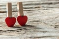 Love Hearts clothespins or pegs on wooden background