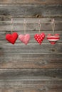 Love hearts hanging on rope on the grey wooden background Royalty Free Stock Photo