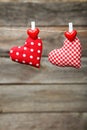 Love hearts hanging on rope on a grey wooden background Royalty Free Stock Photo