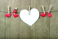 Love hearts hanging on rope on a wooden background. Love concept. Valentine`s day card. copy spaces Royalty Free Stock Photo