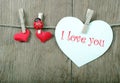Love hearts hanging on rope on a wooden background. Love concept. Valentine`s day card. copy spaces