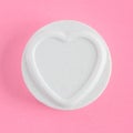 A Love Hearts sweet or candy on a pink background with copy space