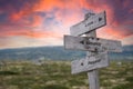 Love honesty respect text engraved in wooden signpost outdoors in nature during sunset a