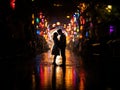 Love Illuminated: Romantic Couple Basks in the Glow of Colorful Lights