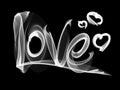 Love isolated word lettering and heart written with fire flame or smoke on black background Royalty Free Stock Photo