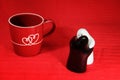 Love, kiss and hug with heart on cup, salt and pepper