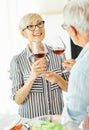 love kitchen senior glass woman couple home retirement happy food smiling husband wine together portrait Royalty Free Stock Photo