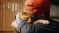 Love knows no boundaries as this man holds his feline friend close, cherishing the bond they share