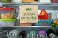 Love Leftovers Eat Me First handmade sign in fridge Royalty Free Stock Photo