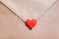 Love letter in a craft envelope with clay red heart