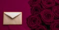 Love letter and flowers delivery on Valentines Day, luxury bouquet of roses and card on maroon background for romantic holiday