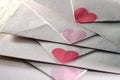 Envelopes sealed with red and pink hearts for Valentines Day, greeting cards, love letters, or weddings