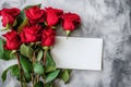 Love letter mockup. Red roses and a blank white sheet of a paper, top view, flatlay. Royalty Free Stock Photo