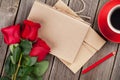 Love letter notepad, red roses and coffee cup Royalty Free Stock Photo