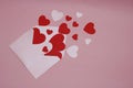 Love letter with paper hearts and Pink Envelope on Pink background Royalty Free Stock Photo