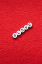 Love letter on a red background, letters in the form of plastic buttons with a sign hashtag