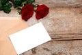 Love letter valentine rose and in envelope on wooden background