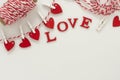 Love letters hanging on a rope. Abstract Valentine's Day background with copy space