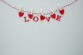 Love letters hanging on a rope. Abstract Valentine's Day background with copy space