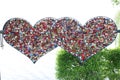 Locks of love locked on two heart-shaped frames on the Gmunden Esplanade, on the western shore of Lake Traunsee. Royalty Free Stock Photo