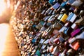 Love locks on the bridge in evening light. Royalty Free Stock Photo