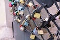 Love locks hang from bridge in Prague representing secure friendship and romance. Padlocks of lovers on bridge as symbol of love. Royalty Free Stock Photo