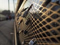 Love locks padlocks on bridge fence during sunset warm color Royalty Free Stock Photo