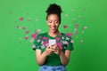 Black woman sending love message on smartphone, hearts flying away Royalty Free Stock Photo