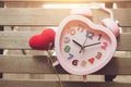 Love memory heart clock on wood background