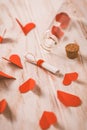 Love message in a bottle with paper hearts on wooden background Royalty Free Stock Photo