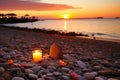 love message written with pebbles on a beach during sunset