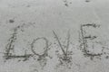 Love message written in sand Royalty Free Stock Photo