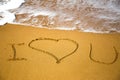 Love message written in sand Royalty Free Stock Photo