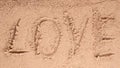 Love message written in sand Royalty Free Stock Photo