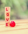 Love message written in wooden blocks. Royalty Free Stock Photo