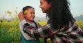 Love, mother and child in flowers field for family bonding moment together in Mexico nature. Happy, care and smile of Royalty Free Stock Photo