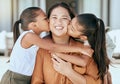Love, mother and girls kiss, hug and happy together with smile and bonding. Portrait, mama and children with embrace Royalty Free Stock Photo