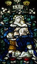 Love (mother with three children) in stained glass Royalty Free Stock Photo