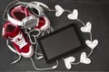 Love for music concept. Red sneakers, headphones, tablet and hearts