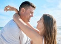 Love, nature and couple hugging on beach, happy man and woman embrace at summer honeymoon destination. Travel, sea and
