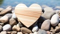 Love in nature, heart shaped pebble on sandy beach generated by AI Royalty Free Stock Photo