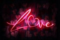 Love Neon Sign on a Dark Wooden Wall with hearts