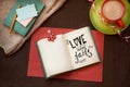 Love never fails - text on beautiful vintage background with cup of coffee and notebook