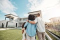 Love, new home and family standing in their backyard looking at their property or luxury real estate. Embrace, mortgage Royalty Free Stock Photo