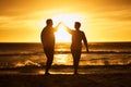 Love, ocean and sunset, silhouette of couple on beach holding hands in Bali. Waves, romance and man and woman dancing in Royalty Free Stock Photo