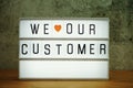 We love our customer word in light box business concept background Royalty Free Stock Photo
