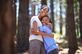 We love the outdoors and each other. Portrait of a mother and son embracing while enjoying a day outdoors. Royalty Free Stock Photo