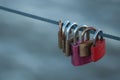 Love padlock on steel cable